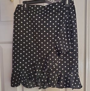 Black and white polka dot ruffled skirt.